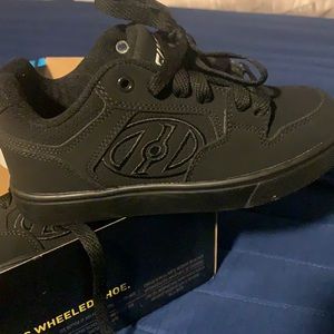 All black wheel on a shoe